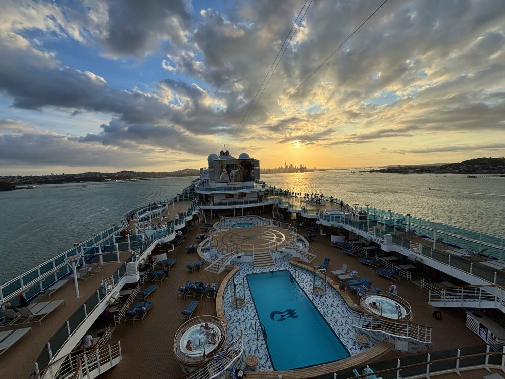 http://www.dannysluxurycruisevacations.com/wp-content/uploads/2026/03/1_sunset-over-auckland-from-royal-princess.jpegautoformat2Cenhanceampcropentropyampfitcropampixlibreact-9.10.jpg